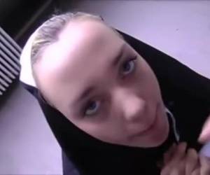 Horny nun bares her bald pussy on the stass