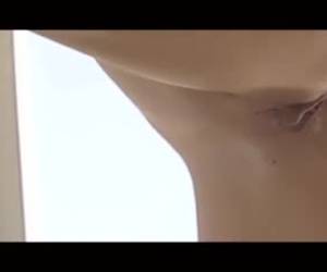 Passionate couple went to a vacation and decided to make love near the huge window